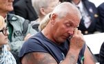 Um homem limpa as lágrimas durante a 17ª comemoração anual do 11 de setembro no Memorial Nacional do Voo 93, próximo a Shanksville, Pensilvânia
Um homem limpa as lágrimas durante a 17ª comemoração anual do 11 de setembro no Voo 93 National Memorial perto de Shanksville, Pensilvânia, EUA, 11 de setembro de 2018. REUTERS / Kevin Lamarque