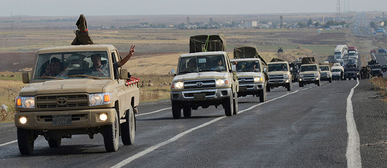 Primeiro grupo de combatentes curdos iraquianos peshmergas entrou na cidade sitiada de Kobani
