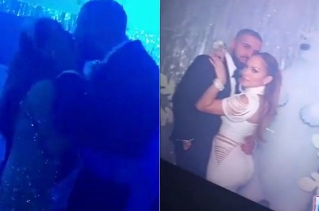 Drake e Jennifer Lopez se beijando em festa
