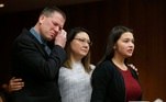 Ashleigh Weiszerbod reads her victim impact statement as her parents stand with her during the sentencing hearing of Larry Nassar, a former team USA Gymnastics doctor who pleaded guilty in November 2017 to sexual assault charges, in the Eaton County Court in Charlotte, Michigan, U.S., February 2, 2018. REUTERS/Rebecca Cook