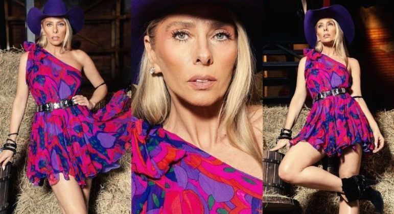 Galisteu apostou no roxo para a Prova do Fazendeiro! Ela apareceu com vestido soltinho de um ombro só, chapéu e ankle boot. A loira escolheu mix de pulseiras e cinto com fivela dupla para compor o visual. As cores vibrantes do vestido deixaram o figurino hipnotizante! 