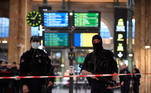 French police stand guard in a cordonned off area at Paris' Gare du Nord train station, after several people were lightly wounded by a man wielding a knife on January 11, 2023. The man was arrested by police at the station, which serves as a hub for trains to London and northern Europe, after they opened fire and wounded him, said a police source, who asked not to be named.