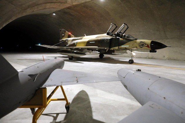 A handout picture provided by the Iranian Army office on February 7, 2023 shows a fighter jet during the unveiling of Iran's first underground military air base in an undisclosed location.
