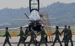 China-Airshow-Zhuhai
Pilots of Chengdu Aircraft Corporation's J-10 for the People's Liberation Army Air Force (PLAAF) march after performing a flight demonstration programme at the 13th China International Aviation and Aerospace Exhibition in Zhuhai, in southern China's Guangdong province on September 28, 2021.
Noel Celis / AFP
