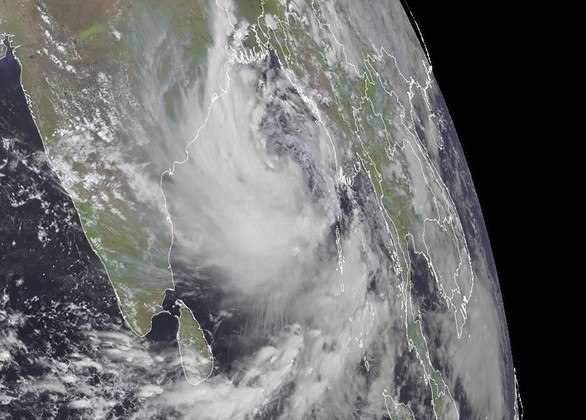 This RAMMB/CIRA handout satellite image shows a cyclone(R) approaching eastern India on May 24, 2021 at 09:00 UTC. Indian authorities on May 24, 2021 ordered the evacuation of nearly half a million people out of the path of a new cyclone heading towards eastern India just one week after another deadly storm smashed into the west coast.The cyclones are hitting as India reels from a surge in coronavirus infections that has plunged the healthcare system into crisis and pushed the country's Covid-19 death toll above 300,000. Experts say storms off India's coast are increasing in frequency and intensity as climate change warms ocean waters.

Handout / RAMMB/CIRA / AFP