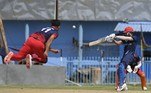 A Peace Defenders team player (R) plays a shot during the Twenty20 cricket trial match being played between the two Afghan teams 'Peace Defenders' and 'Peace Heroes' at the Kabul International Cricket Stadium in Kabul on September 3, 2021.
Aamir QURESHI / AFP
