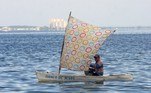 A man fishes in the polluted waters of the Maracaibo Lake, Zulia State, Venezuela, on July 30, 2021. Franklin relies on the wind to power his small sailboat. Manuel, a former bus driver, carries passengers in a 'bicitaxi'. Both manage to survive the chronic fuel shortages in Zulia, the region that saw the birth of Venezuela's oil industry.
Luis BRAVO / AFP