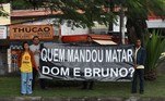 BRAZIL-AMAZON-INDIGENOUS-MEDIA-MURDER-FUNERAL-PHILLIPS
Protesters hold a banner reading 'Who ordered the murder of Dom and Bruno?' outside the Parque da Colina Cemetery in the city of Niteroi, Rio de Janeiro State, Brazil, on June 26, 2022, during the funeral of British journalist Dom Phillips, who was killed in the Amazon forest along with indigenous expert Bruno Pereira. Phillips and Pereira went missing on June 5 in a remote part of the rainforest rife with illegal mining, fishing and logging, as well as drug trafficking. They were shot while returning from an expedition in the Javari Valley.
LUCIOLA VILLELA / AFP