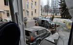 Ukrainian service members are seen outside the damaged local city hall of Kharkiv on March 1, 2022, destroyed as a result of Russian troop shelling. The central square of Ukraine's second city, Kharkiv, was shelled by advancing Russian forces who hit the building of the local administration, regional governor Oleg Sinegubov said. Kharkiv, a largely Russian-speaking city near the Russian border, has a population of around 1.4 million.
Sergey BOBOK / AFP