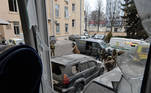 Ukrainian service members are seen outside the damaged local city hall of Kharkiv on March 1, 2022, destroyed as a result of Russian troop shelling. The central square of Ukraine's second city, Kharkiv, was shelled by advancing Russian forces who hit the building of the local administration, regional governor Oleg Sinegubov said. Kharkiv, a largely Russian-speaking city near the Russian border, has a population of around 1.4 million.
Sergey BOBOK / AFP