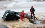 GREECE-WEATHER-FLOOD
Rescue workers try to retrieve a vehicle pushed by flood waters into the sea along the beach of the popular resort of Agia Pelagia, on the southern Greek island of Crete, following flash floods on October 15, 2022. A man was found dead and two others are missing following the flash flood.
AFP