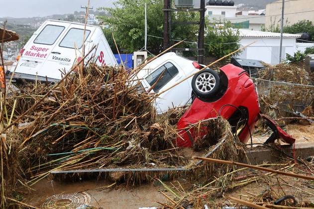 GREECE-WEATHER-FLOOD
Damaged cars are pilled up in the village of Agia Pelagia on the southern Greek island of Crete, following flash floods on October 15, 2022.
Costas METAXAKIS / AFP