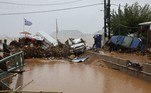 GREECE-WEATHER-FLOOD
Firemen and residents look at the damage in the village of Agia Pelagia on the southern Greek island of Crete, following flash flood on October 15, 2022.
Costas METAXAKIS / AFP
