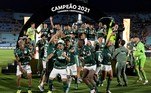 Palmeiras players celebrate at the podium of the Copa Libertadores football tournament after defeating Flamengo in the all-Brazilian final match, at the Centenario stadium in Montevideo, on November 27, 2021.
Juan Mabromata / AFP