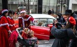 JAPAN-LIFESTYLE-CHRISTMAS
Member of a vintage car group Hiroyuki Wada (C), dressed as Santa Claus, poses with dogs as he gives out Christmas presents to the public on a street in Tokyo's Marunouchi area on December 24, 2023.
Philip FONG / AFP