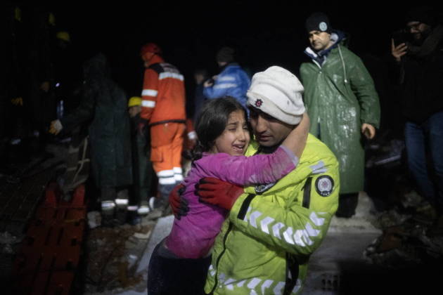 Police officer Zekeriya Yildiz hugs his daughter after they saved her from the rubble in Hatay on February 6, 2023, after a 7.8-magnitude earthquake struck the country's south-east. A major 7.8-magnitude earthquake struck Turkey and Syria, killing more than 3,000 people and flattening thousands of buildings as rescuers dug with bare hands for survivors.