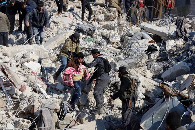 A man carries the body a child pulled out from the rubble in the town of Harim, in Syria's rebel-held noryhwestern Idlib province on the border with Turkey, on February 8, 2023, two days after a deadly earthquake that hit Turkey and Syria. The death toll from the massive earthquake that struck Turkey and Syria on February 6 rose above 8,300, official data showed, with rescue workers on February 8 still searching for trapped survivors.
Mohammed AL-RIFAI / AFP