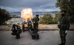 A soldier fires a cannon from Lycabettus hill as Greece celebrates the 200th anniversary of the 1821 Revolution and War of Independence, in Athens, on March 25, 2021.
ANGELOS TZORTZINIS / AFP
