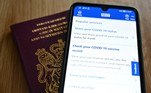 An illustration picture shows a smartphone screen displaying a Covid-19 vaccine record on the National Health Service (NHS) app in London on May 18, 2021.
JUSTIN TALLIS / AFP
