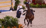 Israel's Alberto Michan riding Cosa Nostra falls as he competes in the equestrian's jumping individual qualifying during the Tokyo 2020 Olympic Games at the Equestrian Park in Tokyo on August 3, 2021.
Behrouz MEHRI / AFP
