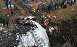 Rescuers pull the body of a victim who died in a Yeti Airlines plane crash in Pokhara on January 16, 2023. Nepal observed a day of mourning on January 16 for the victims of the nation's deadliest aviation disaster in three decades, with 67 people confirmed killed in the plane crash.
PRAKASH MATHEMA / AFP
