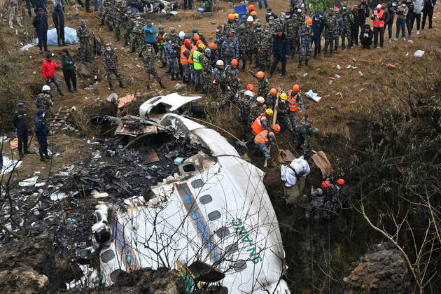 Rescuers pull the body of a victim who died in a Yeti Airlines plane crash in Pokhara on January 16, 2023. Nepal observed a day of mourning on January 16 for the victims of the nation's deadliest aviation disaster in three decades, with 67 people confirmed killed in the plane crash.
PRAKASH MATHEMA / AFP
