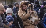 A woman holds her dog after arriving at the Ukrainian-Polish border in Korczowa on March 02, 2022. The number of refugees fleeing the conflict in Ukraine has surged to nearly 875,000, UN figures showed on on March 2, as fighting intensified on day seven of Russia's invasion.
Wojtek RADWANSKI / AFP