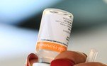 A healthcare worker prepares a dose of the CoronaVac COVID-19 vaccine at a drive-thru vaccination post in Brasilia on September 13, 2021. Brazil is one of the fastest vaccinating countries on the planet, after a late and chaotic start that continues to take its toll on President Jair Bolsonaro.
EVARISTO SA / AFP