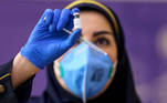 IRAN-HEALTH-VIRUS-VACCINE
An Iranian health worker prepares an injection of the locally-made COVID-19 vaccine during the start of the second phase of trials in the capital Tehran on March 15, 2021.
ATTA KENARE / AFP
