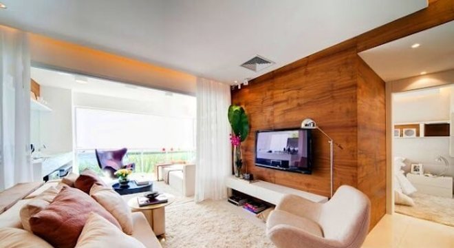 Ambiente decorado com poltronas para sala de tv giratória e sofá