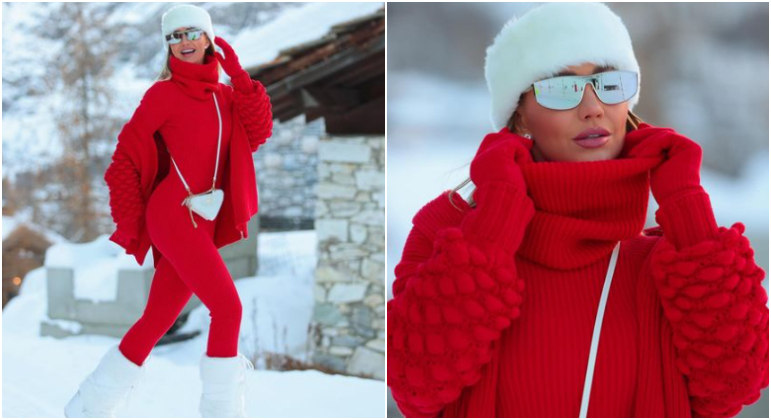 No primeiro dia de viagem, Ana Paula apostou em um look poderoso. Ela estava com um macacão vermelho todo canelado, de gola alta e manga longa. Botas, bolsa e touca brancas arremataram o visual, e o contraste de cores ficou exuberante