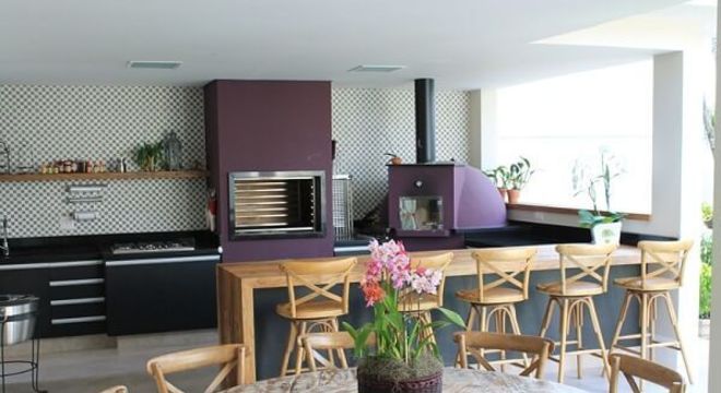 Area de churrasco em varanda de luxo