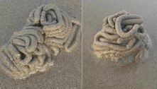 Areia de praia empilhada como fezes intriga banhista (e contém fezes)  