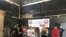 Líderes comunitários lutam para afastar pandemia das favelas