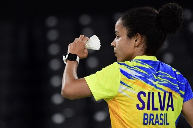 Brazil's Fabiana Silva serves to Ukraine's Maria Ulitina in their women's singles badminton group stage match during the Tokyo 2020 Olympic Games at the Musashino Forest Sports Plaza in Tokyo on July 26, 2021