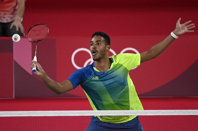 Brazil's Ygor Coelho hits a shot to Mauritius' Georges Julien Paul in their men's singles badminton group stage match during the Tokyo 2020 Olympic Games at the Musashino Forest Sports Plaza in Tokyo on July 26, 2021.
