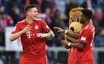 Soccer Football - Bundesliga - Bayern Munich v Hertha BSC - Allianz Arena, Munich, Germany - February 23, 2019 Bayern Munich's Niklas Sule celebrates with David Alaba at the end of the match REUTERS/Andreas Gebert DFL regulations prohibit any use of photographs as image sequences and/or quasi-video