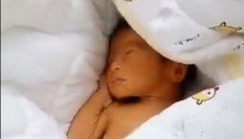 Homens encontram bebê enterrado vivo em caixa de papelão na China