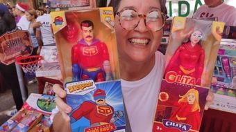 Venezuelan children receive a superhero doll with the face of Nicolás Maduro for Christmas