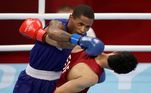 Tokyo 2020 Olympics - Boxing - Men's Lightweight - Last 32 - Kokugikan Arena - Tokyo, Japan - July 25, 2021. Wanderson Oliveira of Brazil in action against Wessam Salamana of the Refugee Olympic Team 
