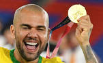 Brazil's gold medallist Dani Alves celebrates after receiving his medal during the medal ceremony of the Tokyo 2020 Olympic Games men's football competition at Yokohama International Stadium in Yokohama, Japan, on August 7, 2021.
