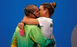 Tokyo (Japan), 01/08/2021.- Bruno Fratus of Brazil (L) gets a kiss as he celebrates with his bronze medal after the Men's 50m Freestyle Final during the Swimming events of the Tokyo 2020 Olympic Games at the Tokyo Aquatics Centre in Tokyo, Japan, 01 August 2021. (Brasil, Japón, Tokio) EFE/EPA/HOW HWEE YOUNG
