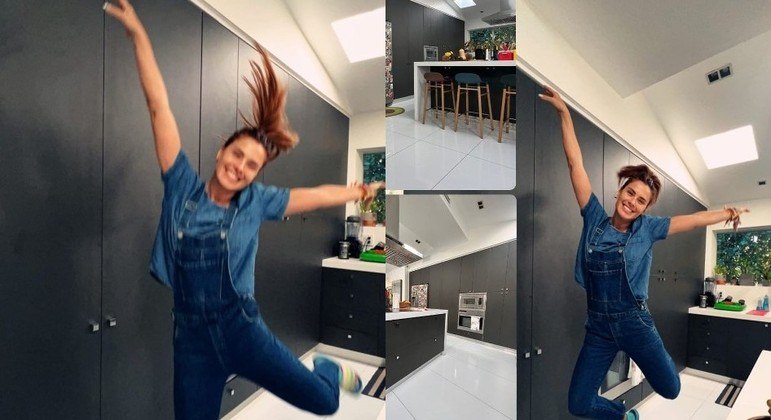 Carolina Dieckmann pulando de alegria na cozinha nova de sua casa