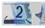 Cédula com pedaços de papel comum