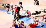 Elisa Balsamo of Italy reacts after Ebtissam Zayed Ahmed of Egypt cycles over her, near Daria Pikulik of Poland, in the aftermath of a crash