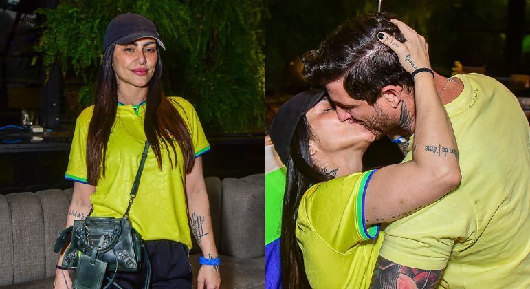 Cleo beija o marido para comemorar gol do Brasil
