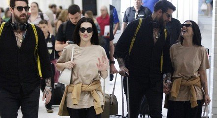 Cleo e o marido em aeroporto no Rio de Janeiro