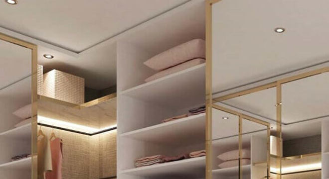 closet luxuoso moderno todo branco decorado com detalhes dourados