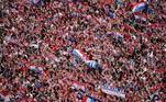 Soccer Football - World Cup - The Croatia team return from the World Cup in Russia - Zagreb, Croatia - July 16, 2018 General view as Croatia fans stand on a rooftop near the main square in Zagreb while they await the arrival of the team REUTERS/Marko Djurica