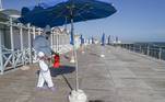 Ostia (Italy), 25/05/2020.- A specialist wearing a protective suit and face mask disinfects a beach resort in Ostia, near Rome, Italy, 25 May 2020. As part of phase two of the coronavirus emergency, a Lazio Region order allows beach resorts to reopen from 29 May, media reported. (Abierto, Italia, Roma) EFE/EPA/EMANUELE VALERI